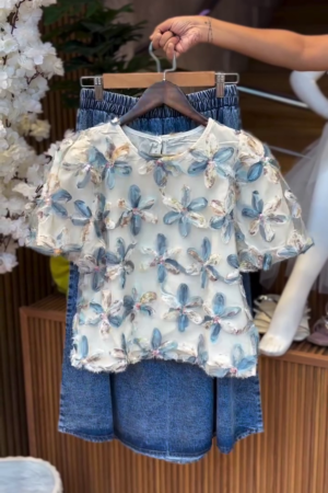 💙🌼 3D Floral Embroidered Mesh Puff Sleeve Top with High-Waisted Smocked Denim Skirt – Textured Cottagecore Chic for Urban Explorers & Dreamers 🌼💙
